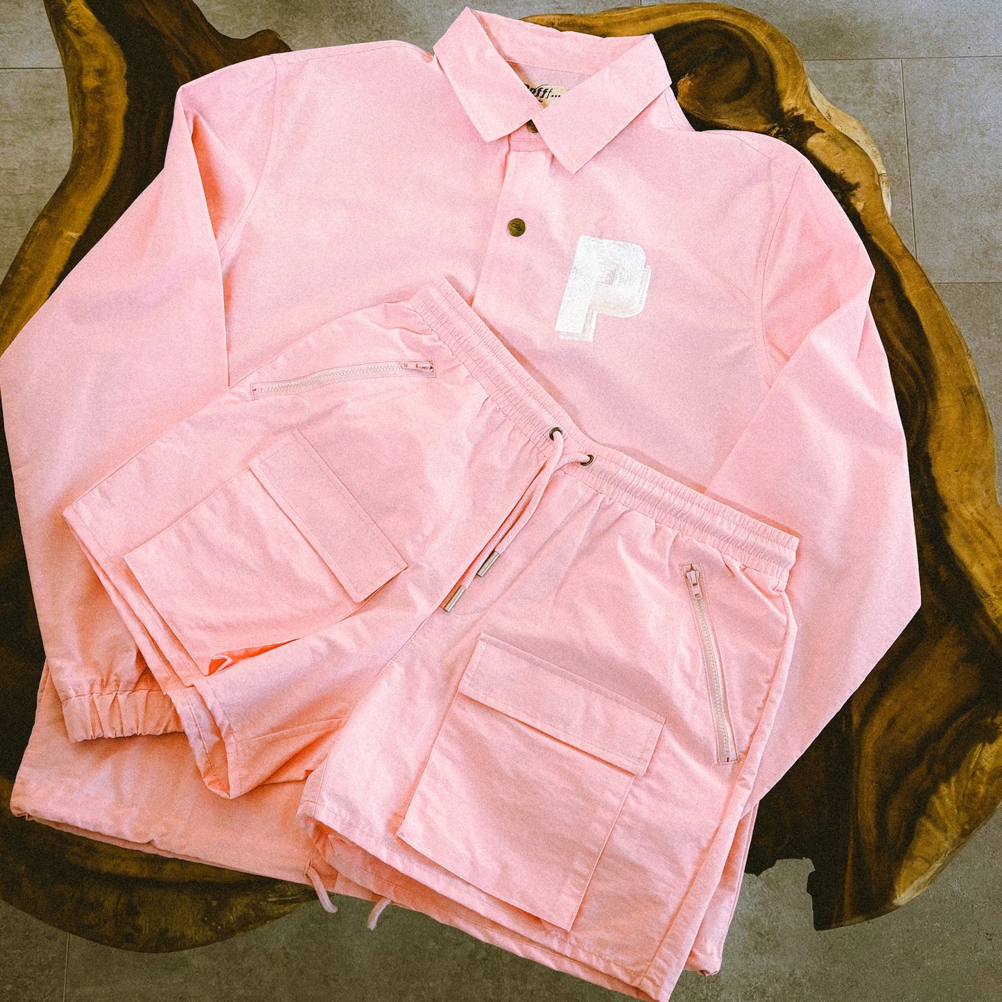 Pink cotton and nylon blend shorts displayed with matching pink coach jacket, spring, summer essentials, menswear, resort, Ppfff.